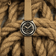 1956 Marine by AV86 vintage-inspired diver watch with acrylic bezel, luminous markers, and textured fabric strap on nautical rope background