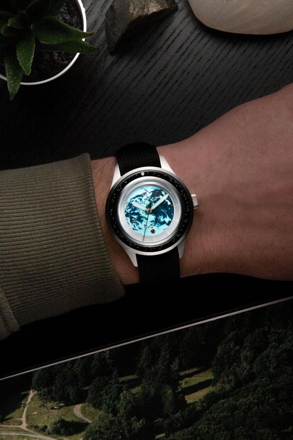 Earthrise WWF Partnership, Automatic / 2025 Edition by AV86 with sapphire crystal, automatic movement, and black fabric strap on wrist