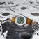 1968 Moonphase by AV86 luxury moonphase watch with textured green dial, sapphire crystal, and vintage leather strap on lunar surface background