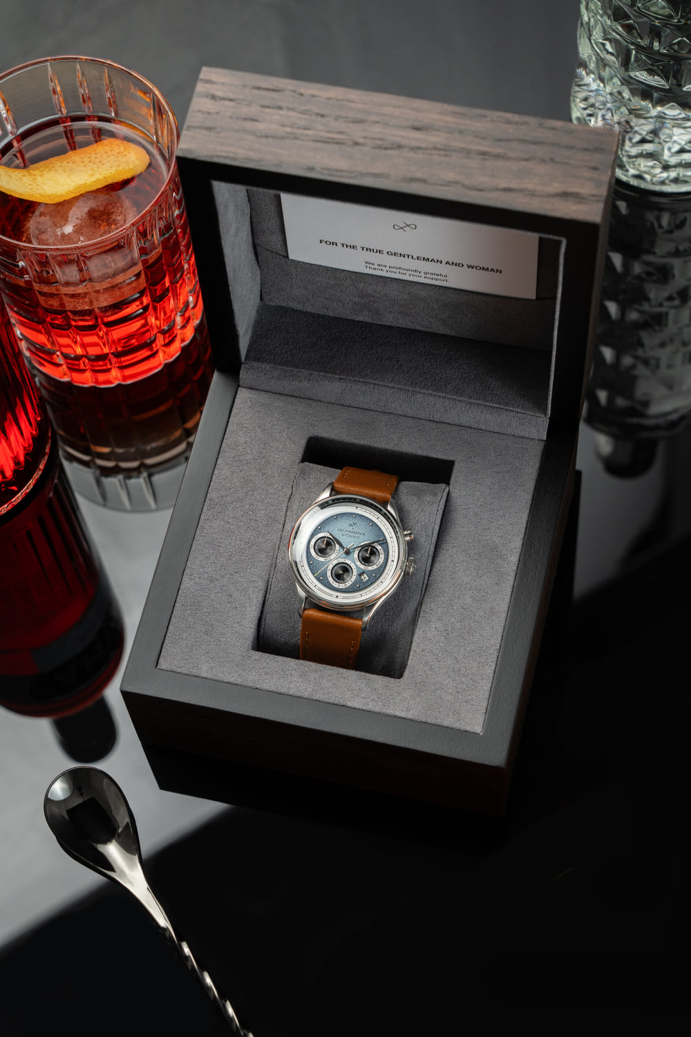 1564 Chronodate Automatic by AV86 vintage-inspired chronograph with sapphire crystal, textured dial, and brown leather strap in wooden box
