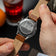 1564 Chronodate Automatic by AV86 with engraved case back, automatic movement, and brown genuine leather strap