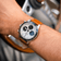 1960 Racing Chronograph by AV86 with vintage-inspired dial, sapphire crystal, chronograph function, and brown leather strap on wrist