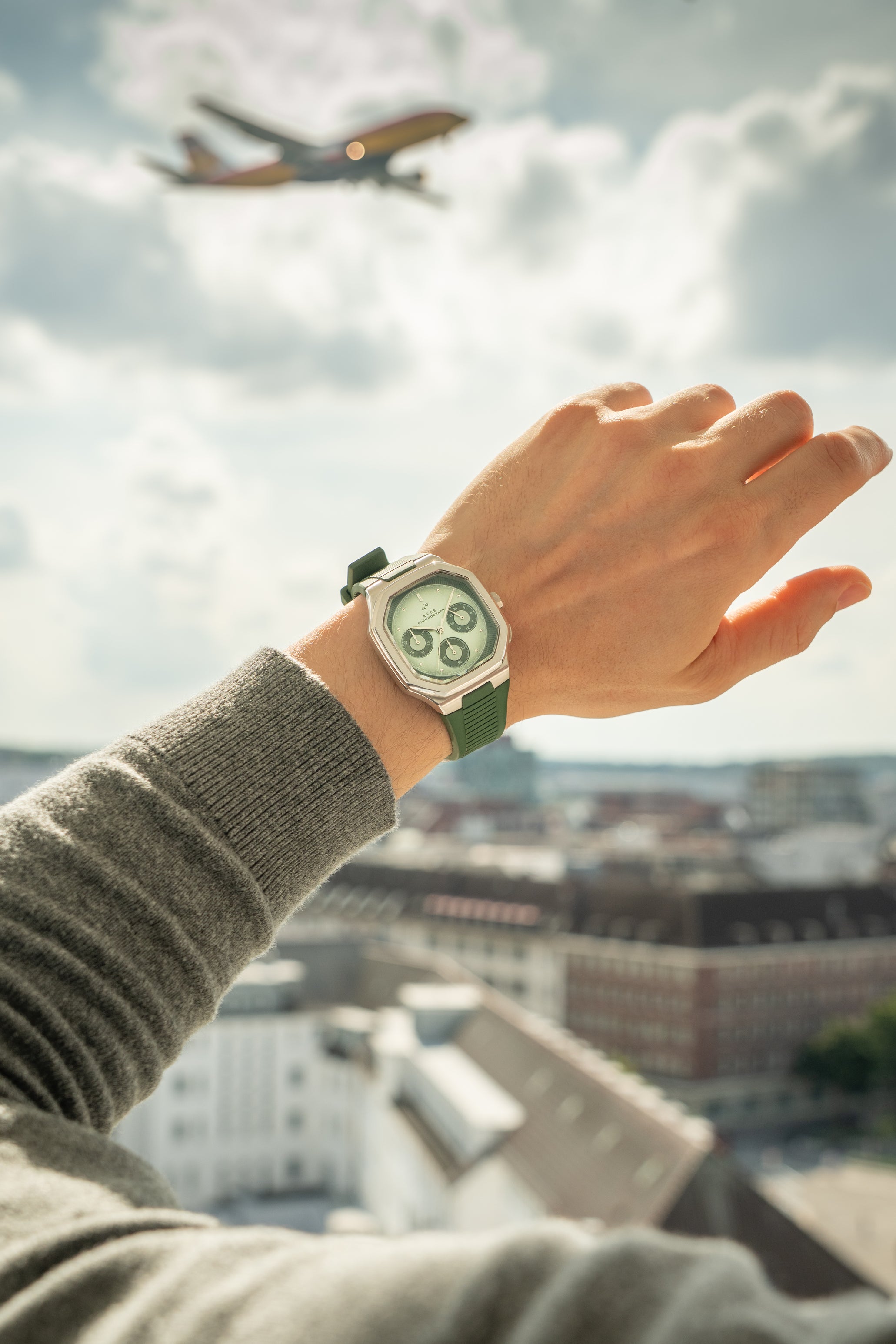 1904 Chronograph by AV86 with angular case, sapphire crystal, chronograph dial, and textured rubber strap in an urban setting