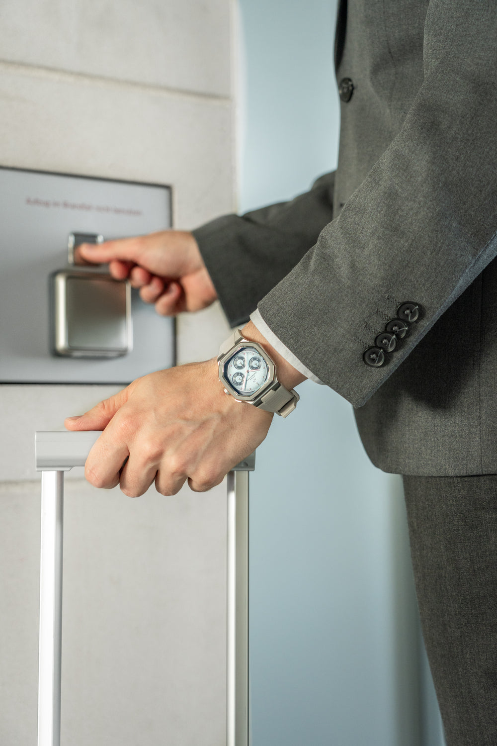 1904 Chronograph by AV86 luxury chronograph with angular case, sapphire crystal, and steel metal bracelet in business setting