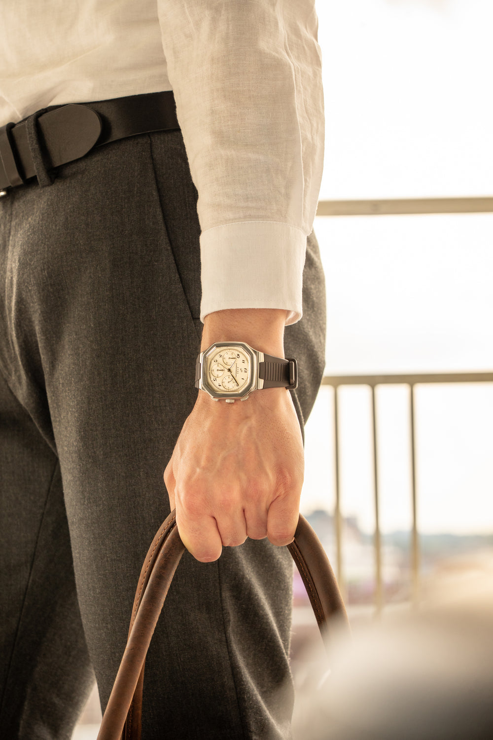 1904 Chronograph by AV86 with angular case, vintage-inspired dial, sapphire crystal, and textured rubber strap in sophisticated setting