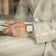 1904 Chronograph by AV86 luxury timepiece with angular case, sapphire crystal, chronograph dial, and metal bracelet strap worn with beige suit