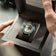 Earthrise WWF Partnership, Automatic / 2026 Edition by AV86 luxury watch with green strap in presentation box held by hands
