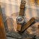 1956 Marine by AV86 vintage-inspired diver with sapphire crystal, compass bezel, and textured fabric strap on newspaper backdrop