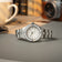 1956 Marine by AV86 vintage-inspired diver watch with sapphire crystal, compass bezel, and polished steel bracelet strap