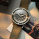 1956 Marine by AV86 vintage-inspired diver with sapphire crystal, compass bezel, and green fabric strap in natural light setting