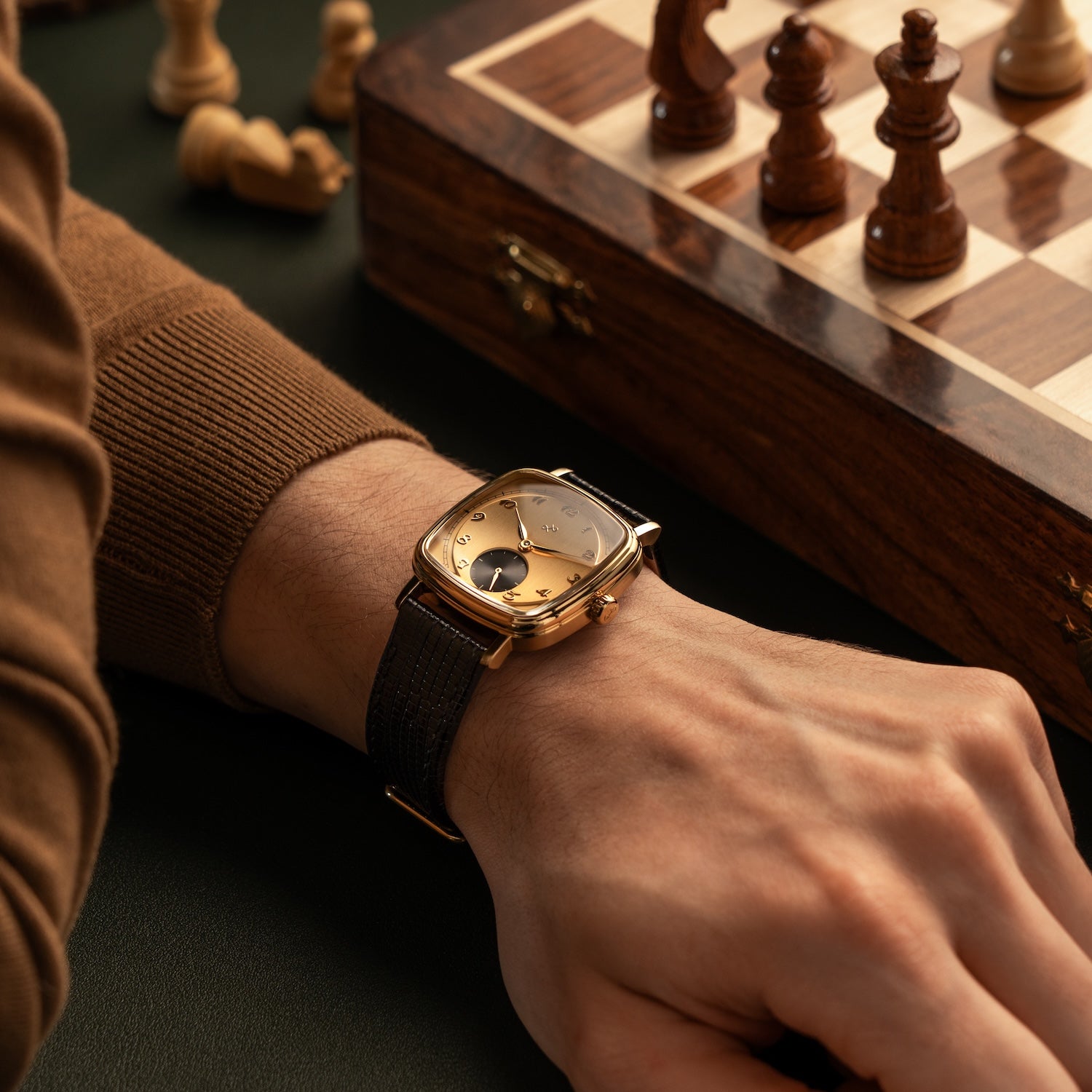 1954 Amalfi Mechanical by AV86, vintage-inspired luxury timepiece with square case, mechanical movement, and textured leather strap worn during chess game