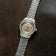 1956 Marine Automatic, Steel / Sand wristwatch by AV86 with a steel bracelet and sand-colored dial on dark brown background