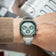 1904 Chronograph by AV86 with angular case, sapphire crystal, chronograph dial, and brushed metal bracelet strap