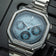 1904 Chronograph by AV86 with angular case, textured dial, sapphire crystal, chronograph subdials, and brushed steel bracelet strap