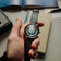 Hand holding 1956 Marine Automatic, Steel / Blue Fade with black leather strap against neutral background, by AV86 with vintage-inspired style