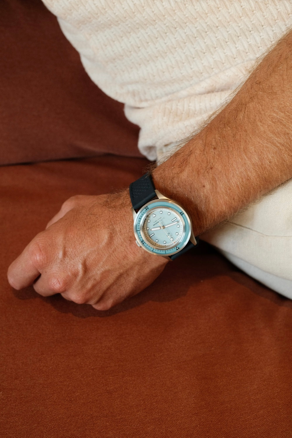 1956 Marine by AV86 luxury diver watch with sapphire crystal, compass bezel, and black textured rubber strap on wrist lifestyle setting