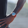 1815 Justin Gatlin, Gold / Blue Turtle by AV86 luxury chronograph with sapphire crystal and orange leather strap on wrist outdoors
