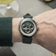 1564 Chronodate Automatic by AV86 luxury vintage-inspired chronograph with sapphire crystal and dark green leather strap on wrist