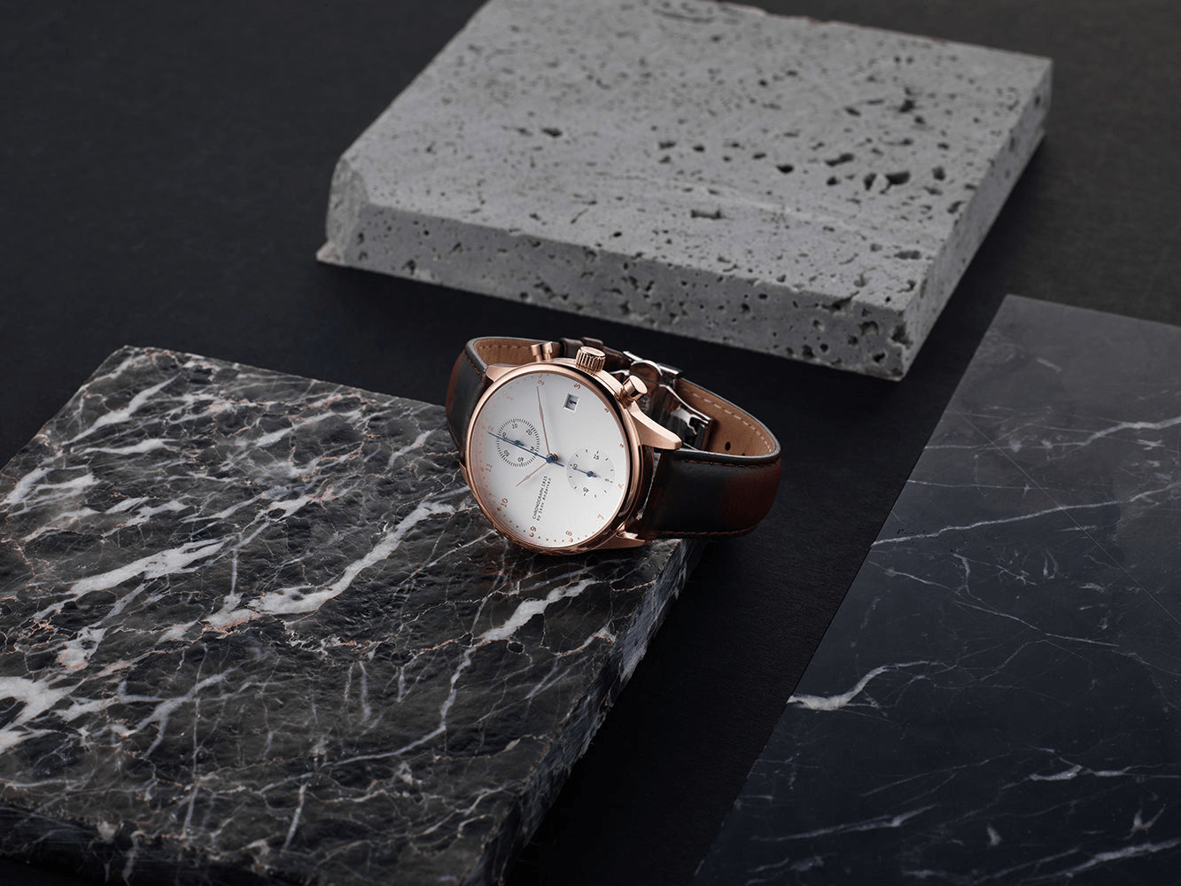 1815 Chronograph by AV86 luxury chronograph with sapphire crystal, vintage-inspired dial, and black leather strap on marble surface