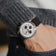1564 Chronodate Automatic by AV86 featuring vintage-inspired chronograph dial, sapphire crystal, date window, and black rubber strap on wrist.
