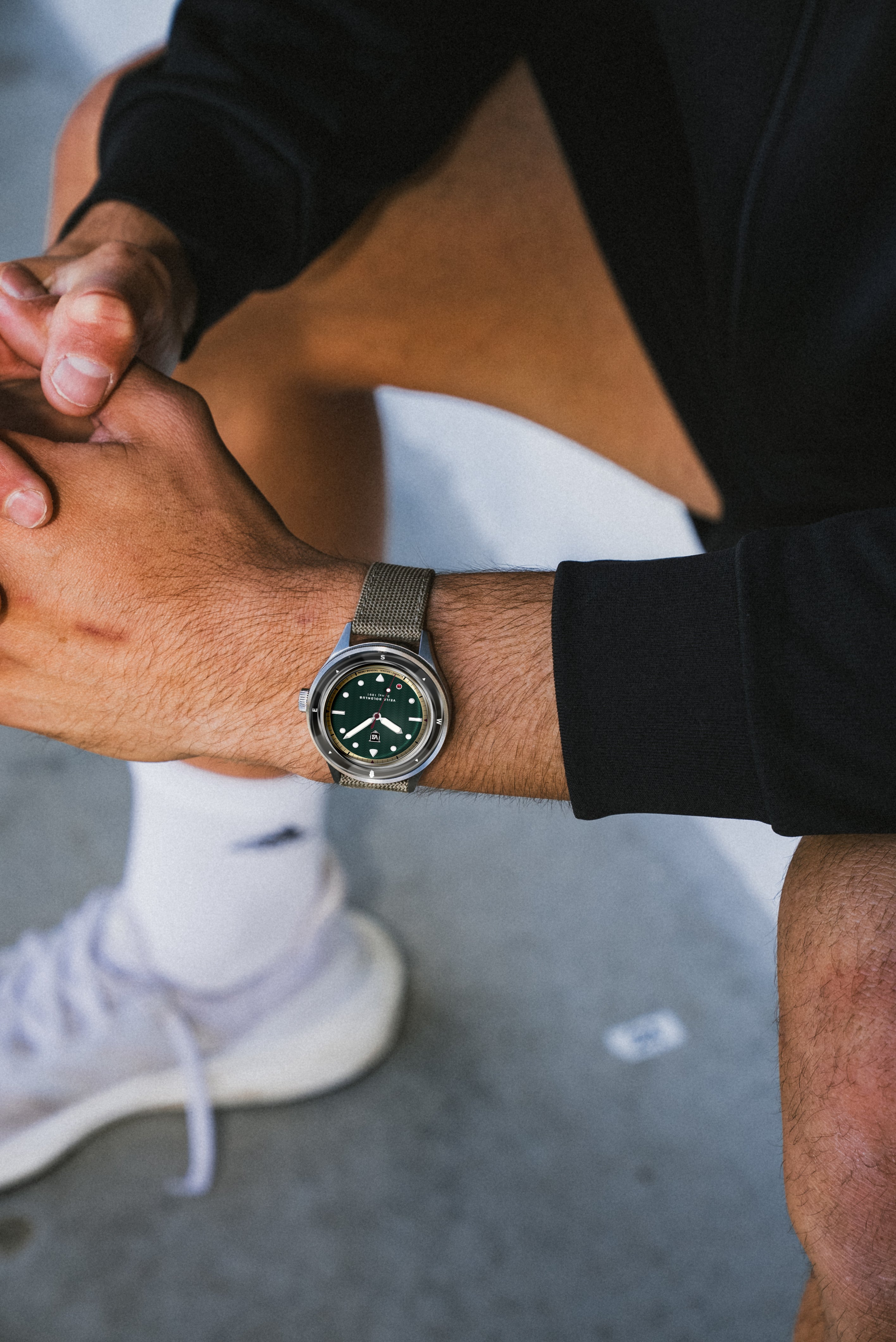 AV86 watch with vintage-inspired dial and sapphire crystal on wrist, casual sporty attire, minimalist urban vibe