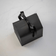 Elegant black gift box with satin ribbon showcasing Gift wrapping by AV86, reflecting Danish minimalist design style.